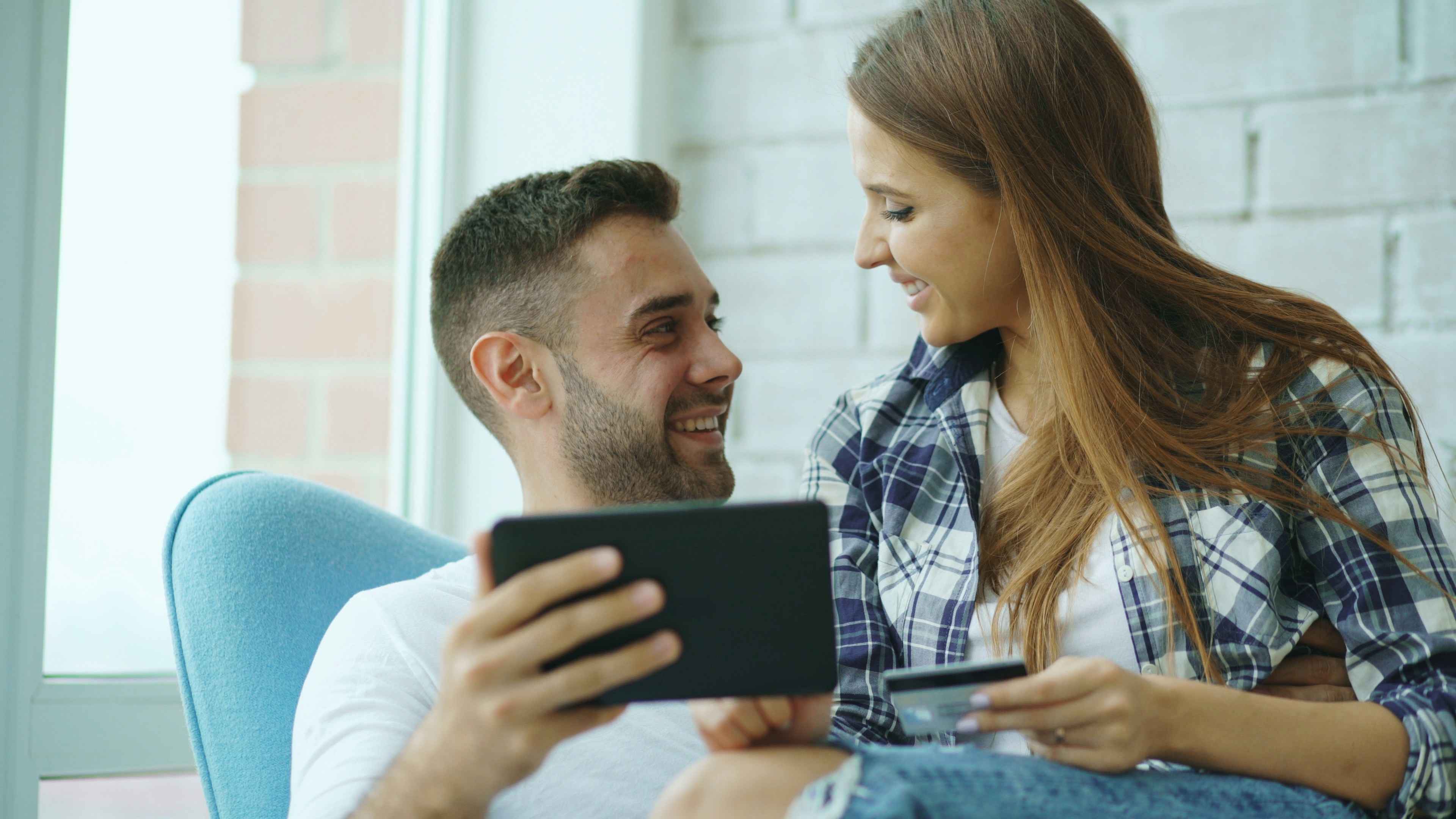 Couples Smiling with Tablet